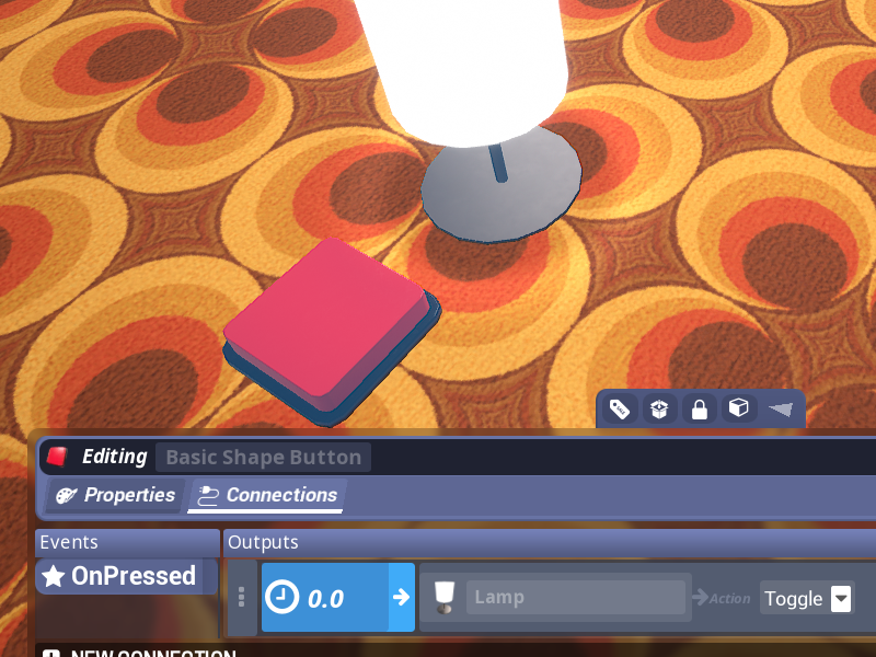 Image shows a lamp and a red button. The connection editor is open, showing that the button is connected to the lamp.